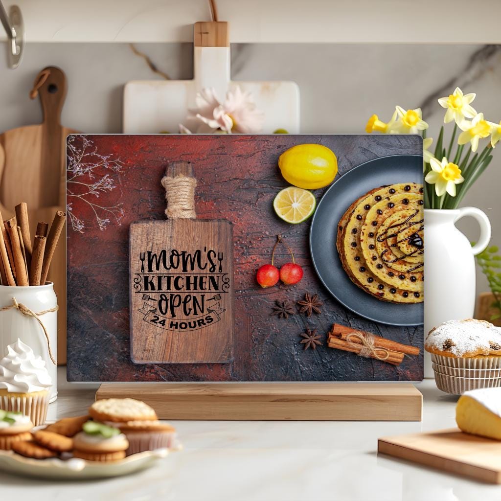 Rectangular glass chopping board with the phrase “Mom’s Kitchen Open 24 Hours.” No personalized text added. Stylish and humorous kitchen decor piece.