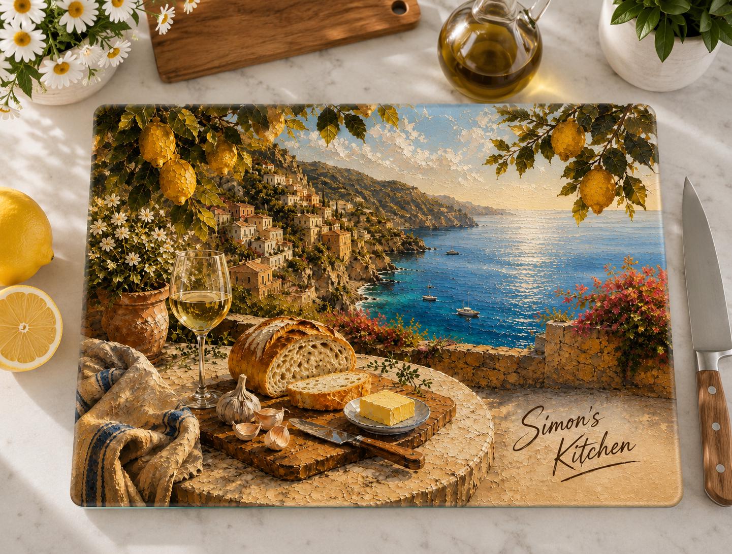Close-up of personalized glass cutting board showing Italian coastal village, wine, and bread scene with custom name