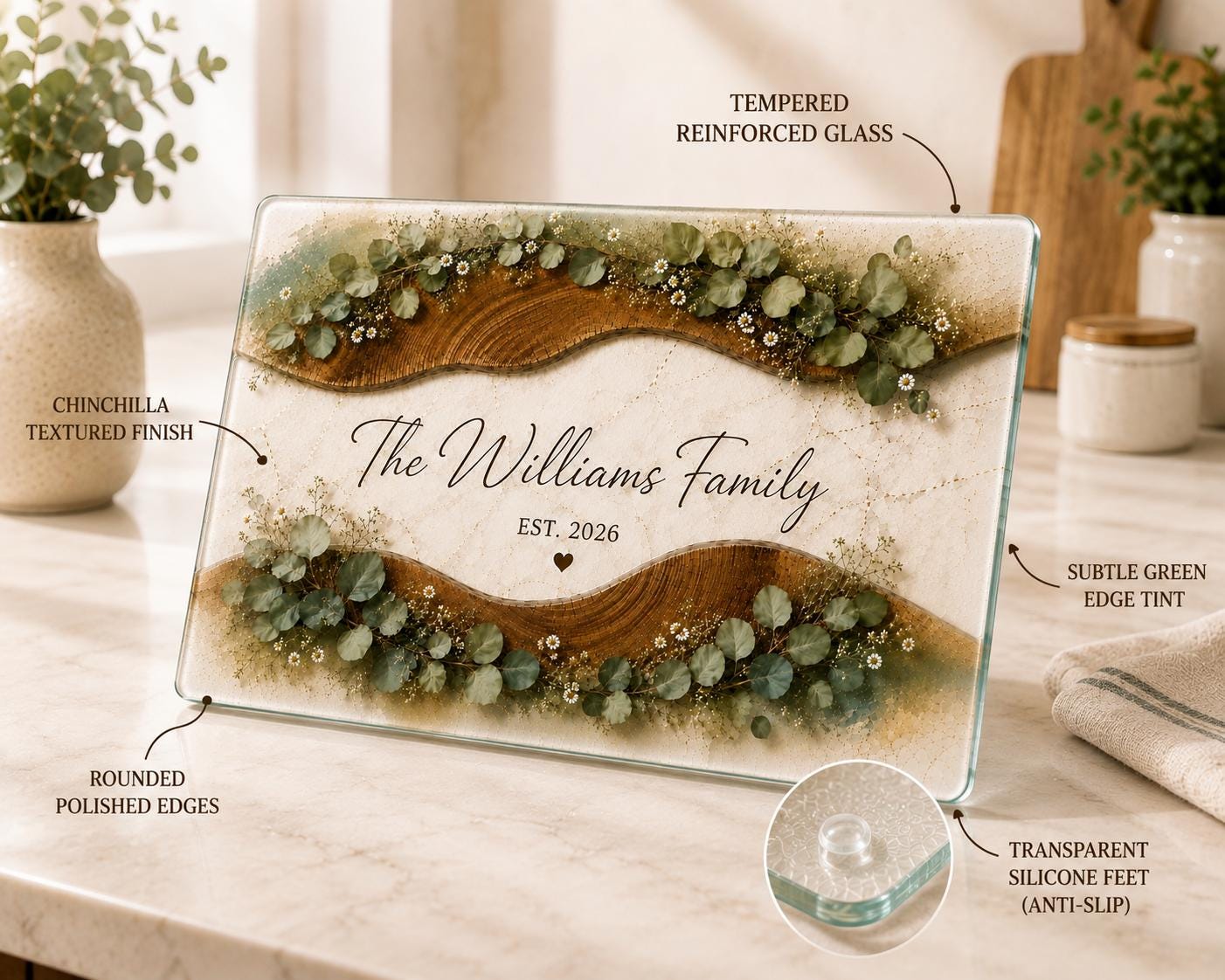 Custom wedding gift glass cutting board with eucalyptus leaves, daisies, wood grain waves, and family name text.