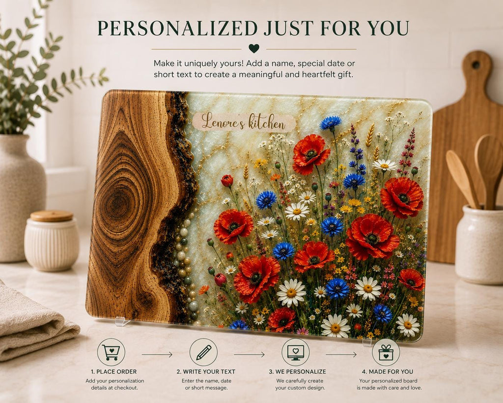 Personalised tempered glass cutting board with wood grain and wildflower epoxy resin effect, featuring poppies, daisies and cornflowers. Product features include chinchilla textured finish, rounded edges and non-slip silicone feet.